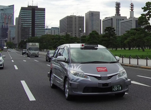A photo of a self-driving minivan taxi